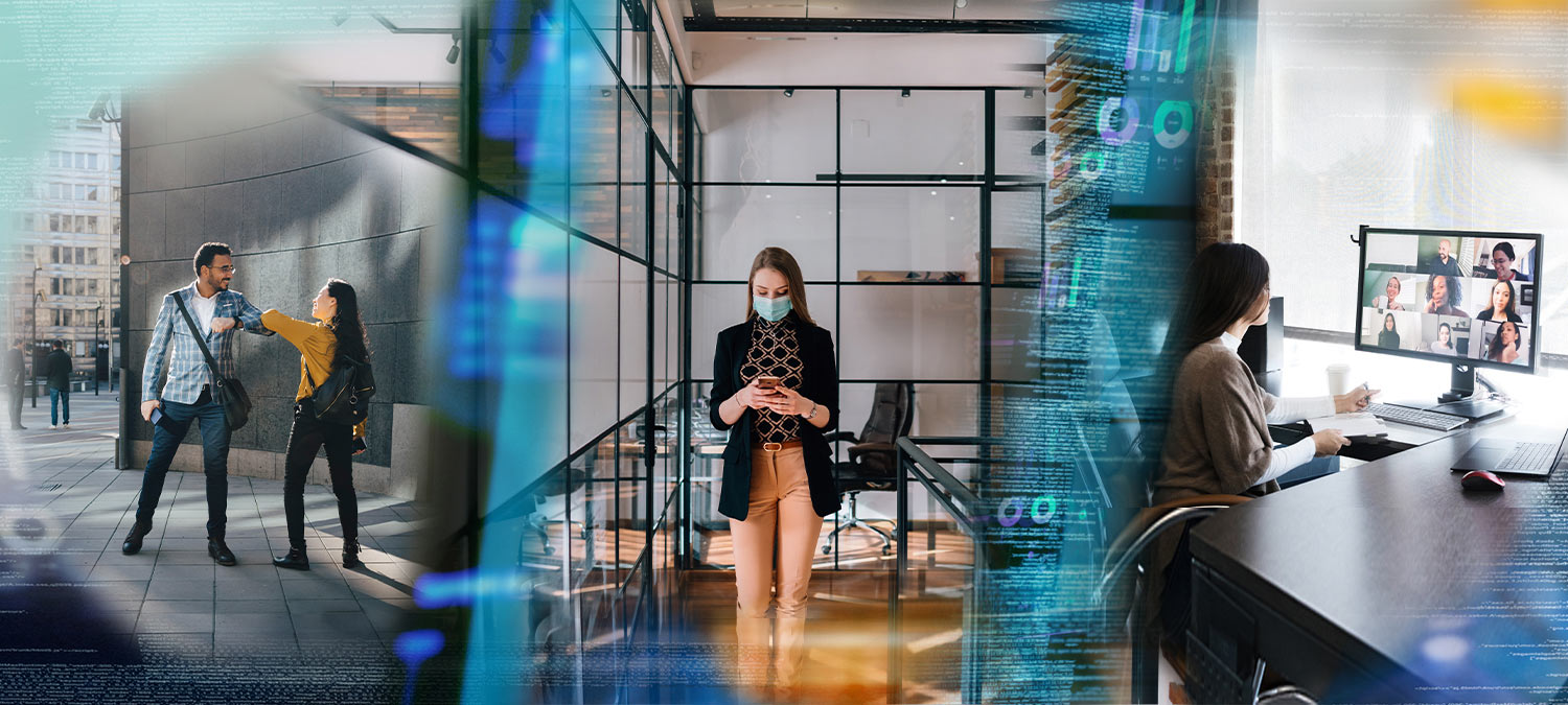 Office workers with masks and working socially distanced