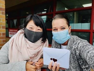 2 girls showing letters during United Way campaign 2020