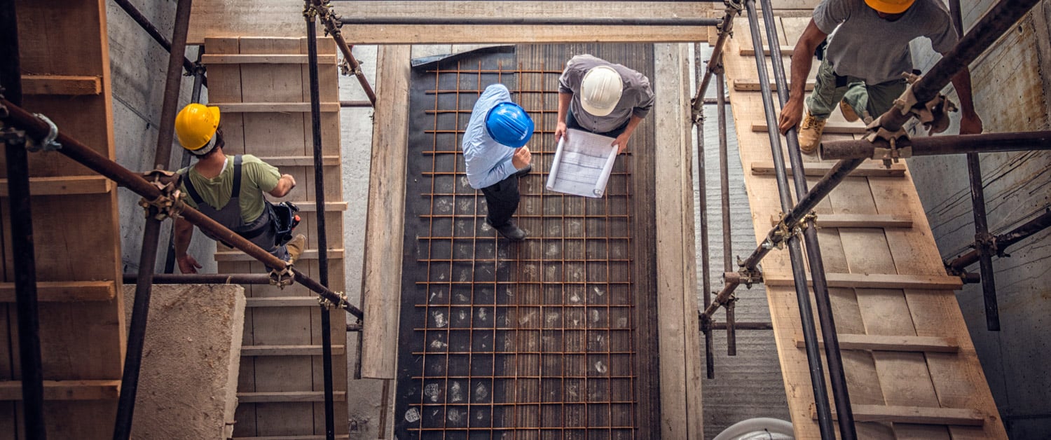 a person sitting on the side of a building