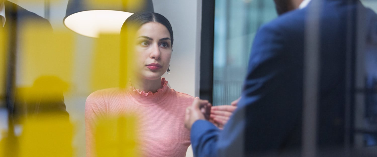 a person standing in front of a mirror posing for the camera