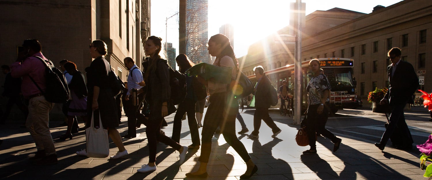 a group of people walking down the street