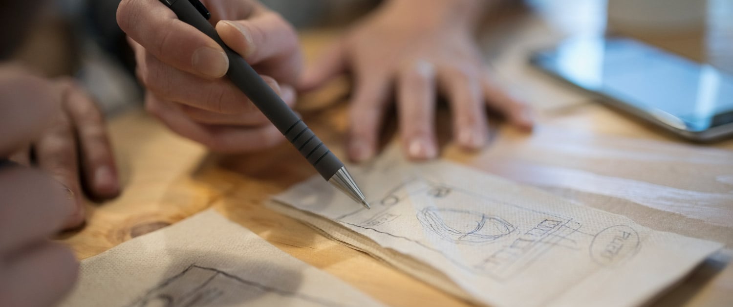 a close up of a person cutting a piece of paper