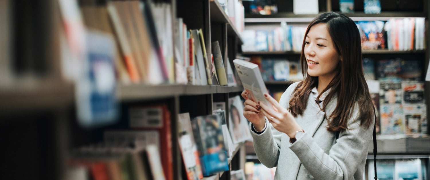 a woman holding a book