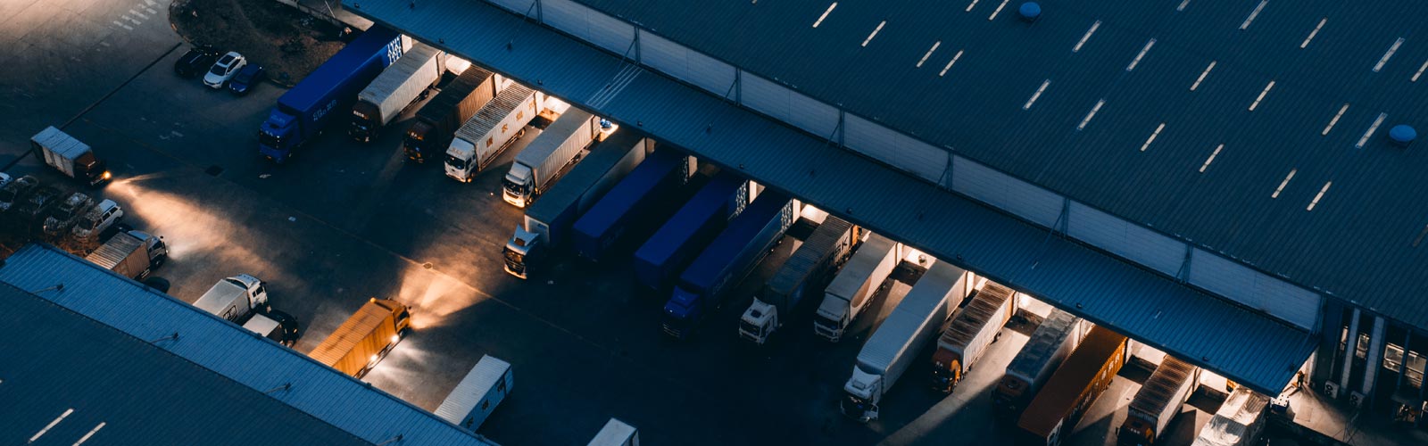 Busy truck depot at night 