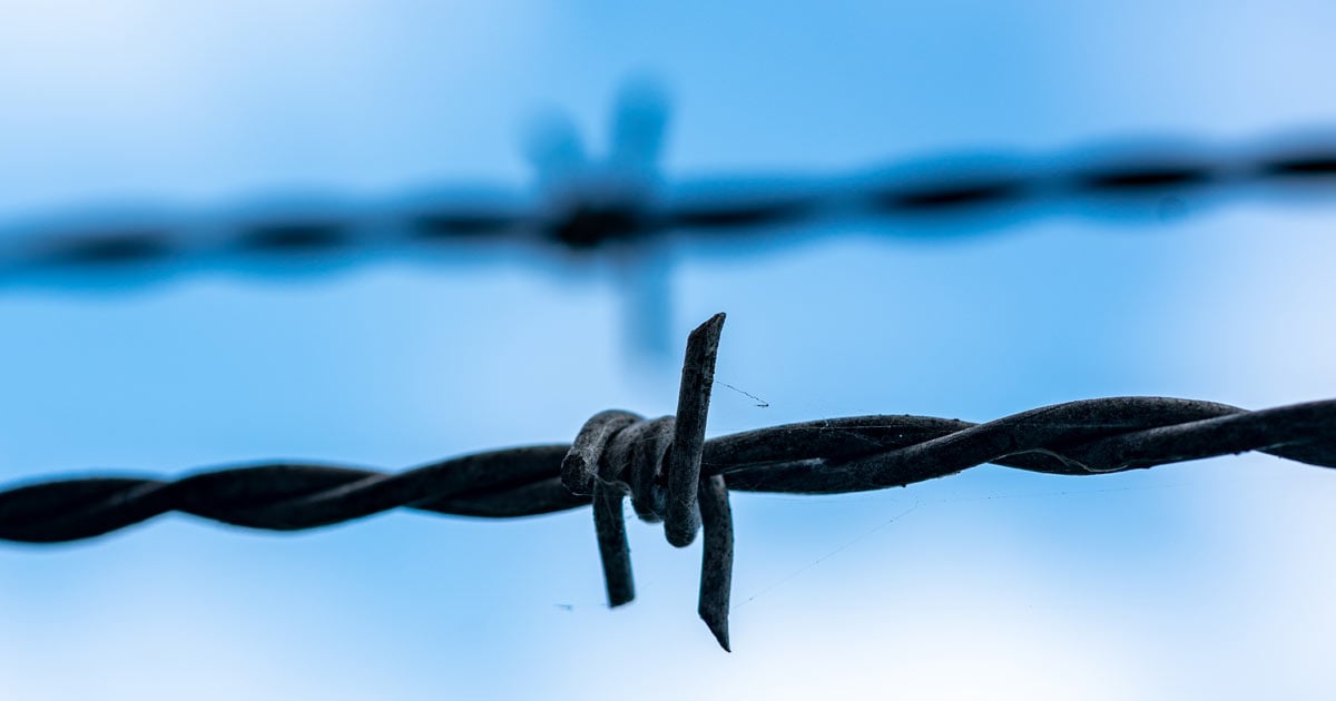 Barbed wire on blue sky 