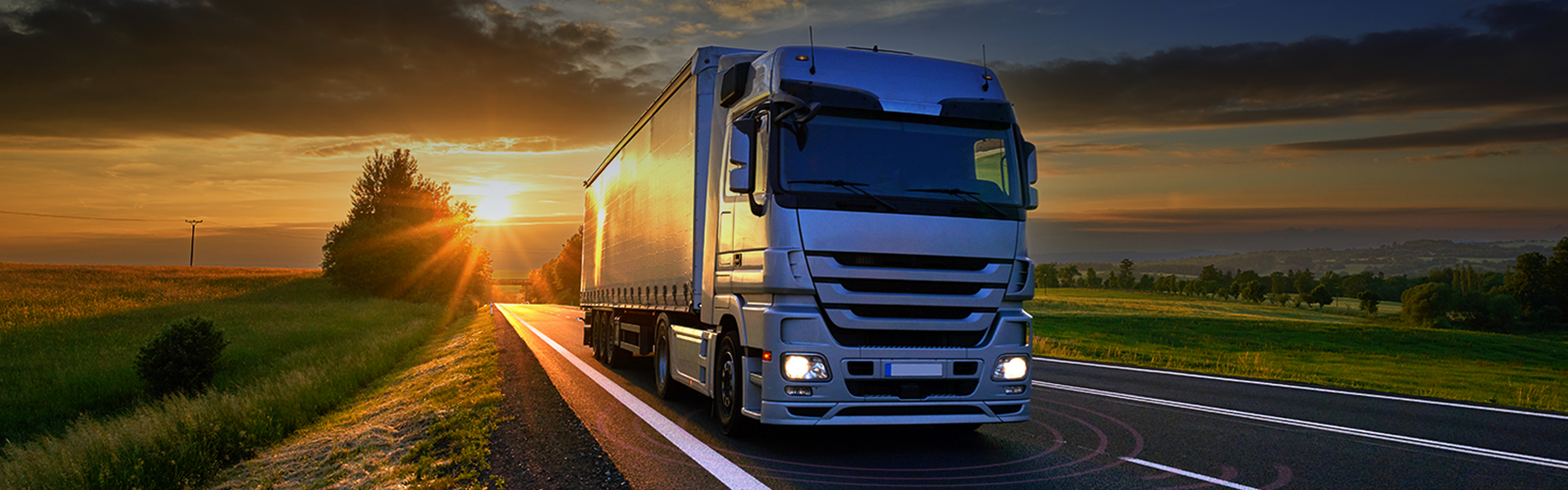 Large truck driving on road